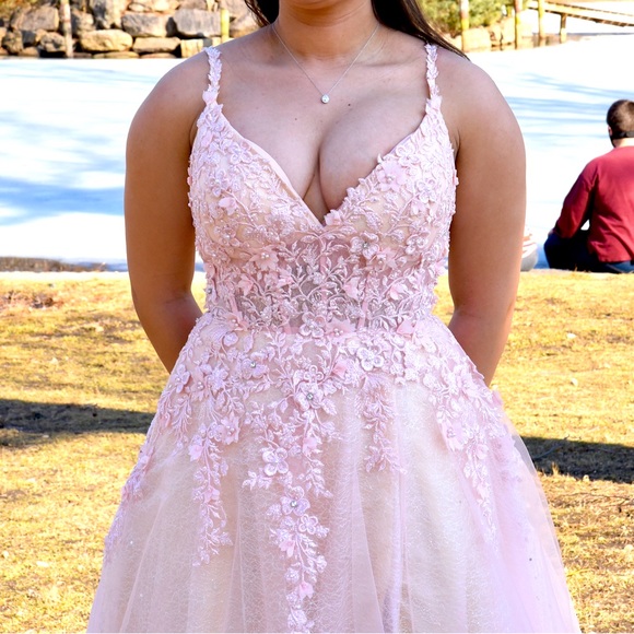dress is a prom, wedding, and Quinceañeras. pale pink dress in size 4